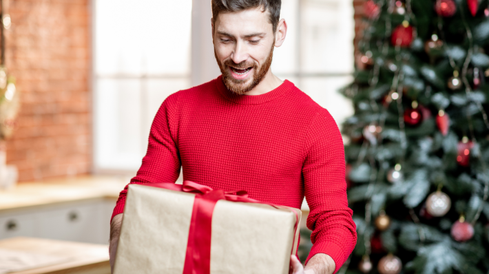 Man receiving gifts in Christmas